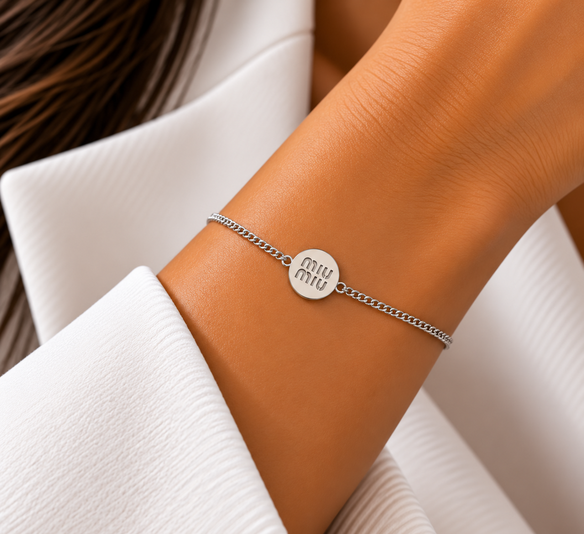 5. Miu Miu Round Logo Bracelet – Silver